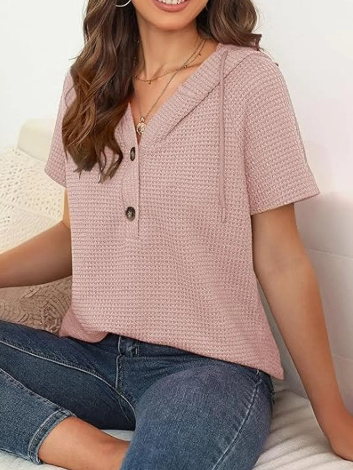 Drawstring waffle-knit short sleeve hooded top with buttons.