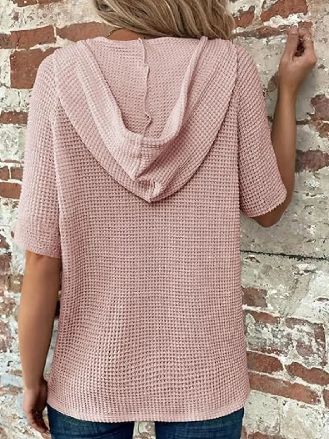 Drawstring waffle-knit short sleeve hooded top with buttons.
