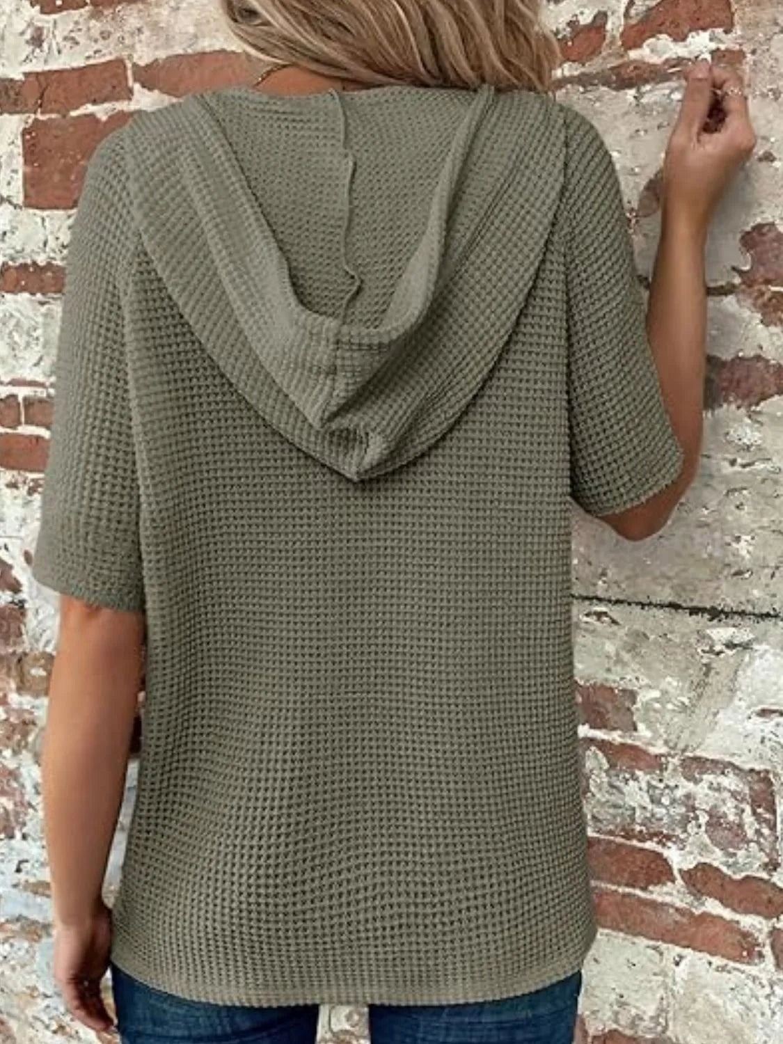 Drawstring waffle-knit short sleeve hooded top with buttons.