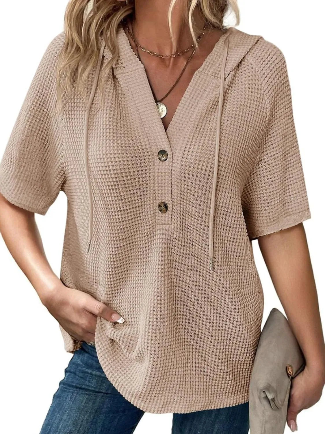 Drawstring waffle-knit short sleeve hooded top with buttons.