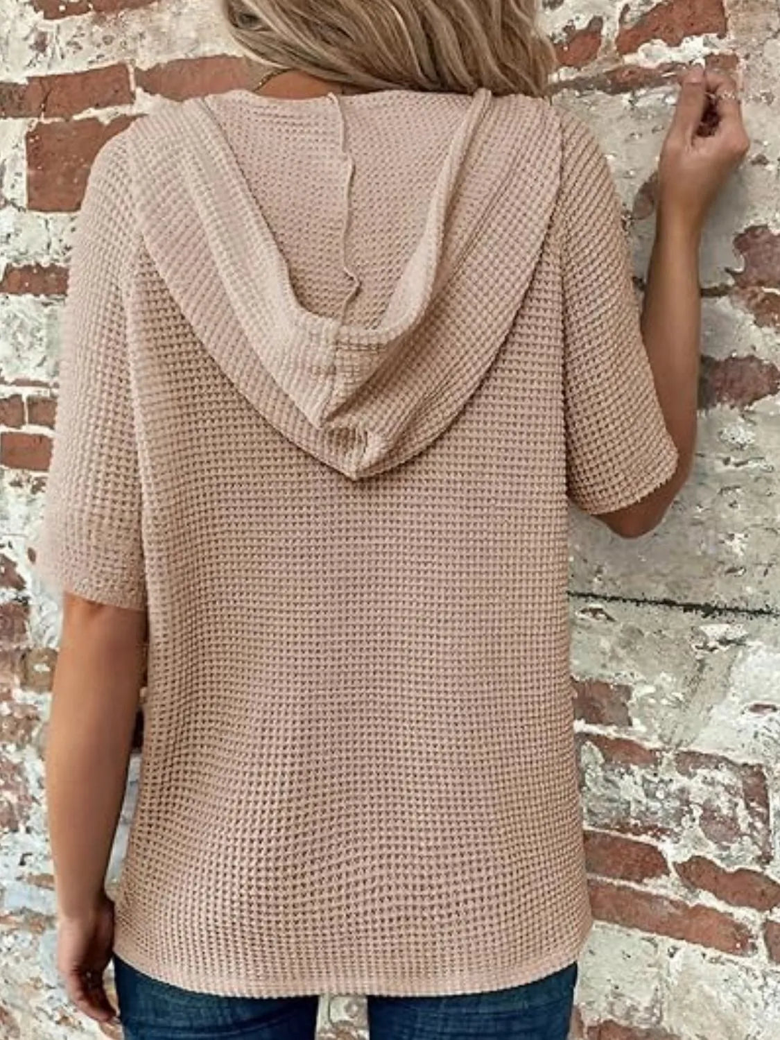 Drawstring waffle-knit short sleeve hooded top with buttons.