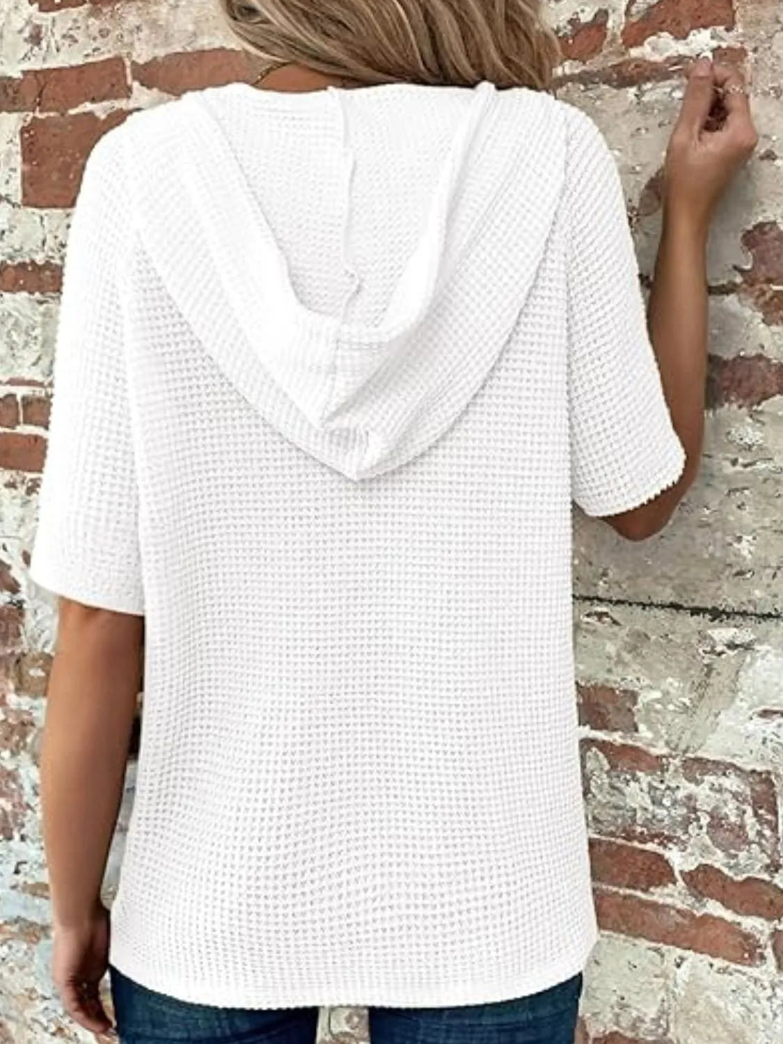 Drawstring waffle-knit short sleeve hooded top with buttons.