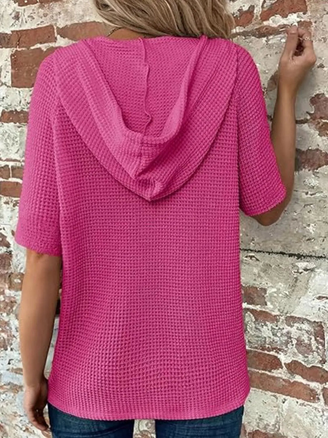 Drawstring waffle-knit short sleeve hooded top with buttons.