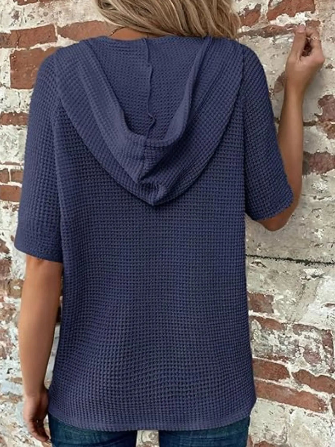 Drawstring waffle-knit short sleeve hooded top with buttons.