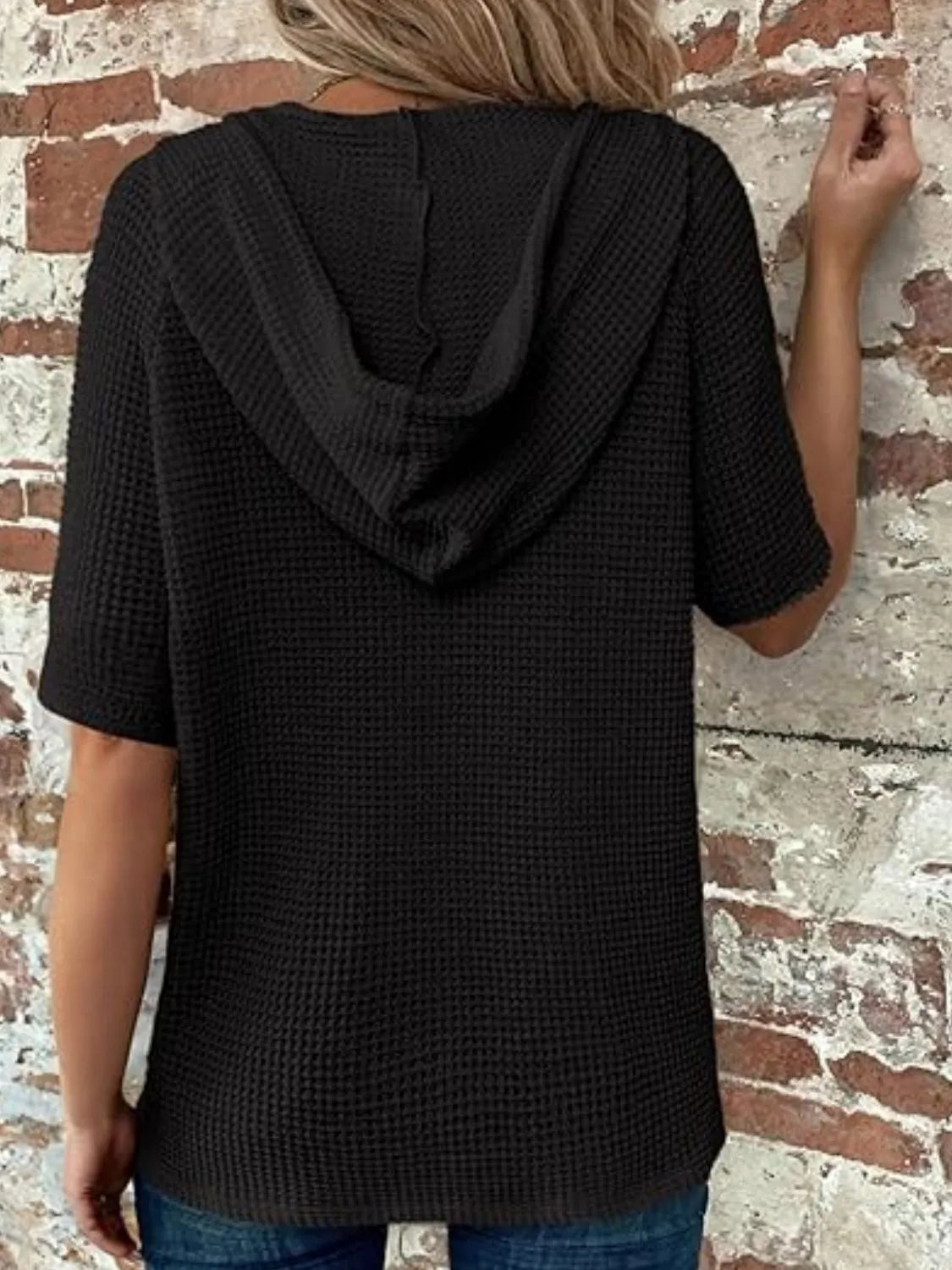 Drawstring waffle-knit short sleeve hooded top with buttons.