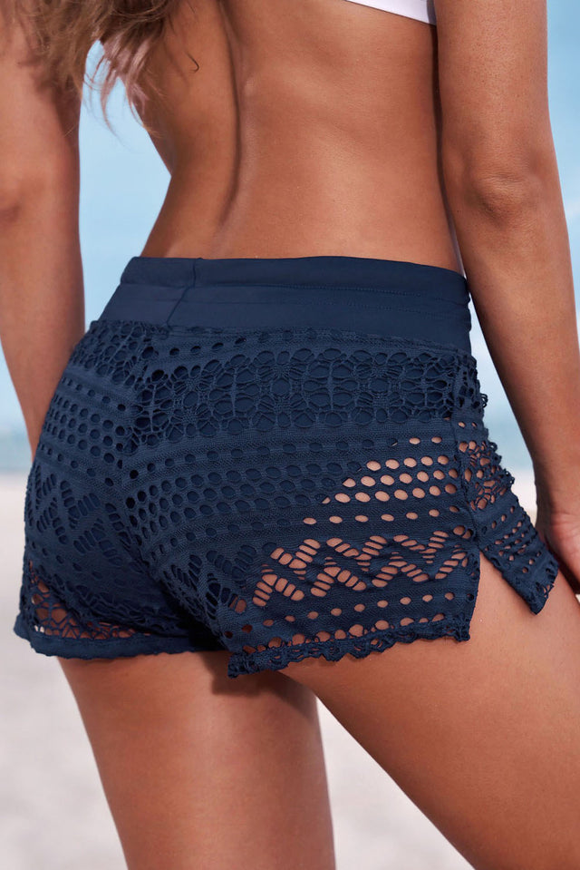 Drawstring waist swim shorts with openwork lace.
