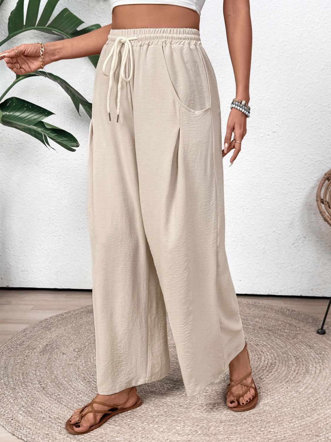 Drawstring wide leg pants with pockets, opaque.