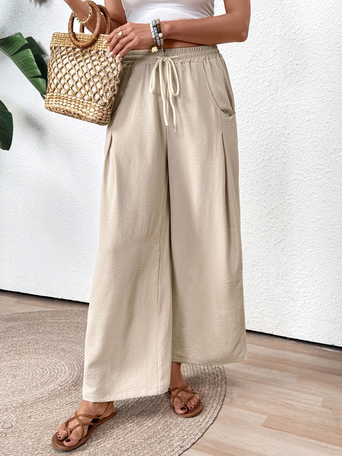 Drawstring wide leg pants with pockets, opaque.