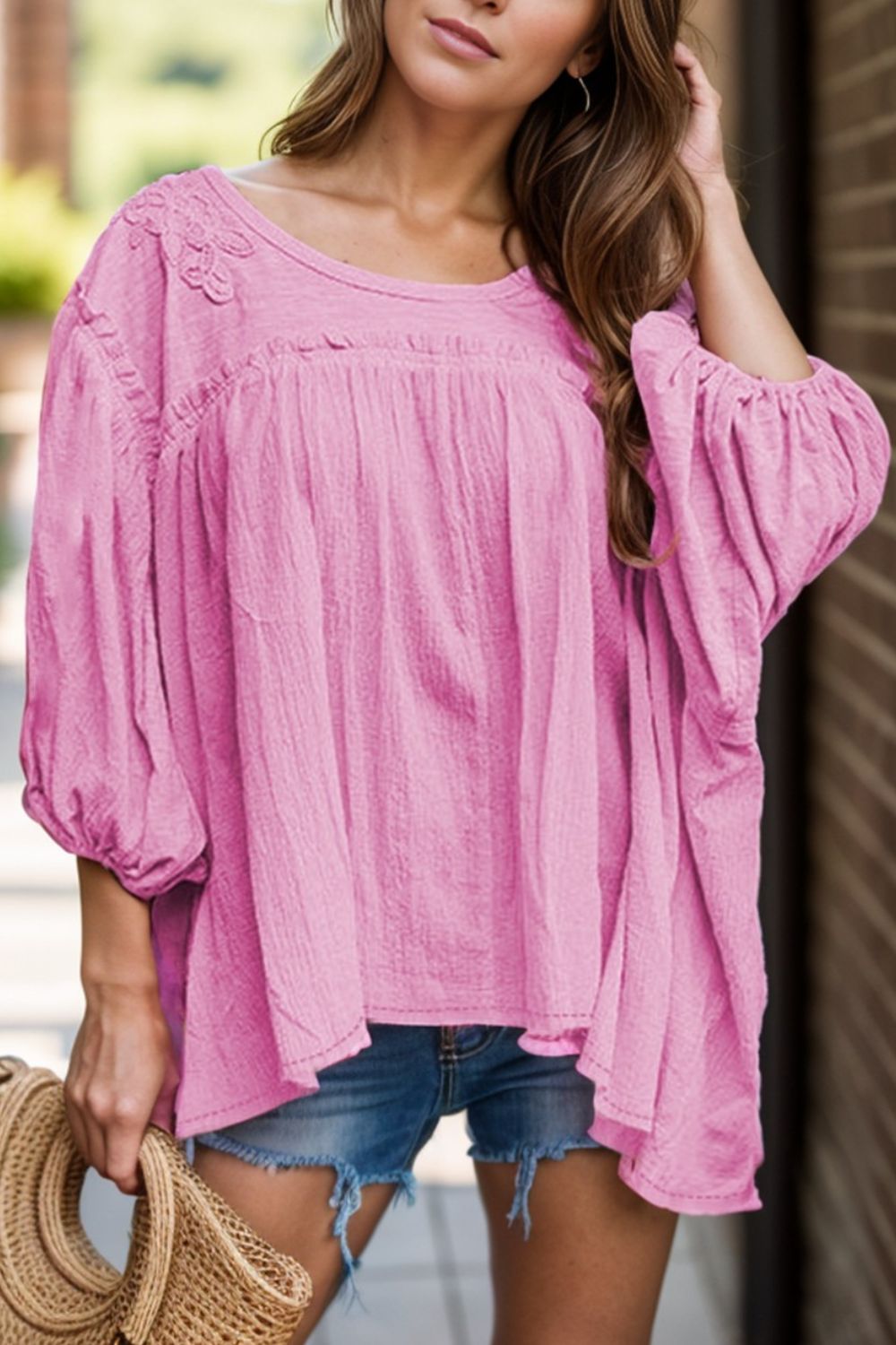 Dropped shoulder round neck blouse with lace detail.