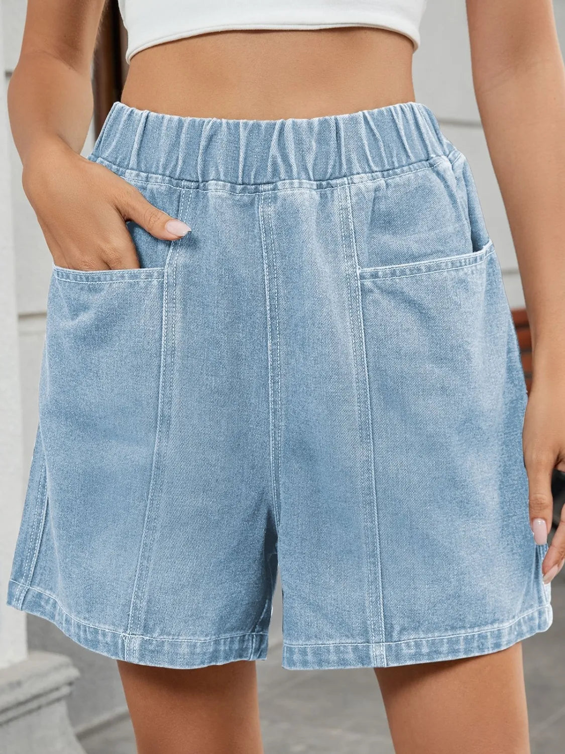 Elastic waist denim shorts with pockets.