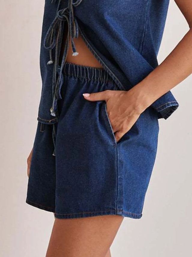 Elastic waist denim shorts with tie detail.