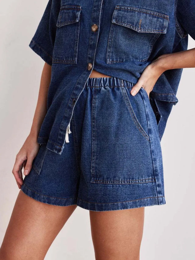 Elastic waist denim shorts with drawstring and pockets.