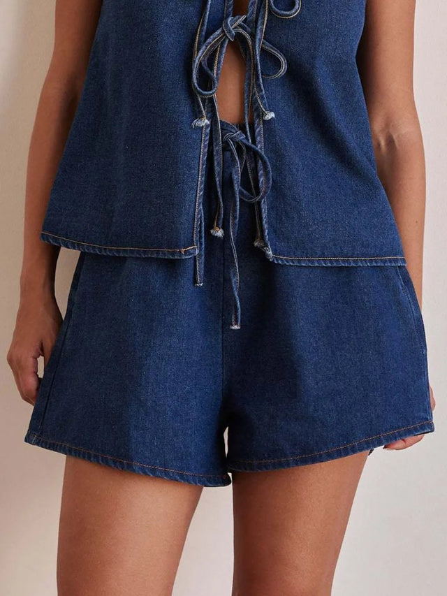 Elastic waist denim shorts with tie detail.