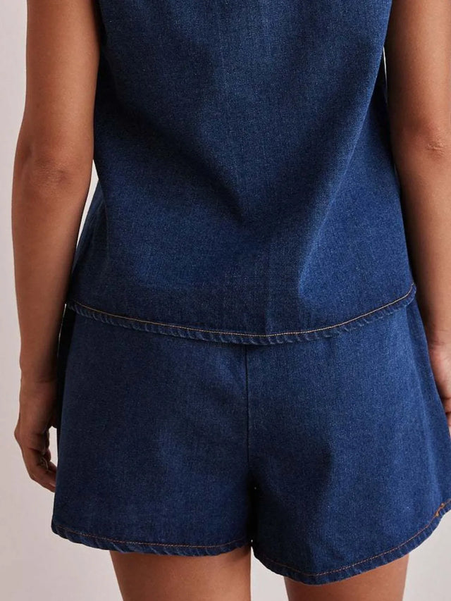 Elastic waist denim shorts with tie detail.