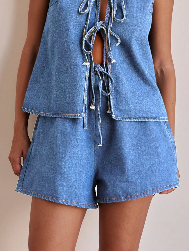 Elastic waist denim shorts with tie detail.
