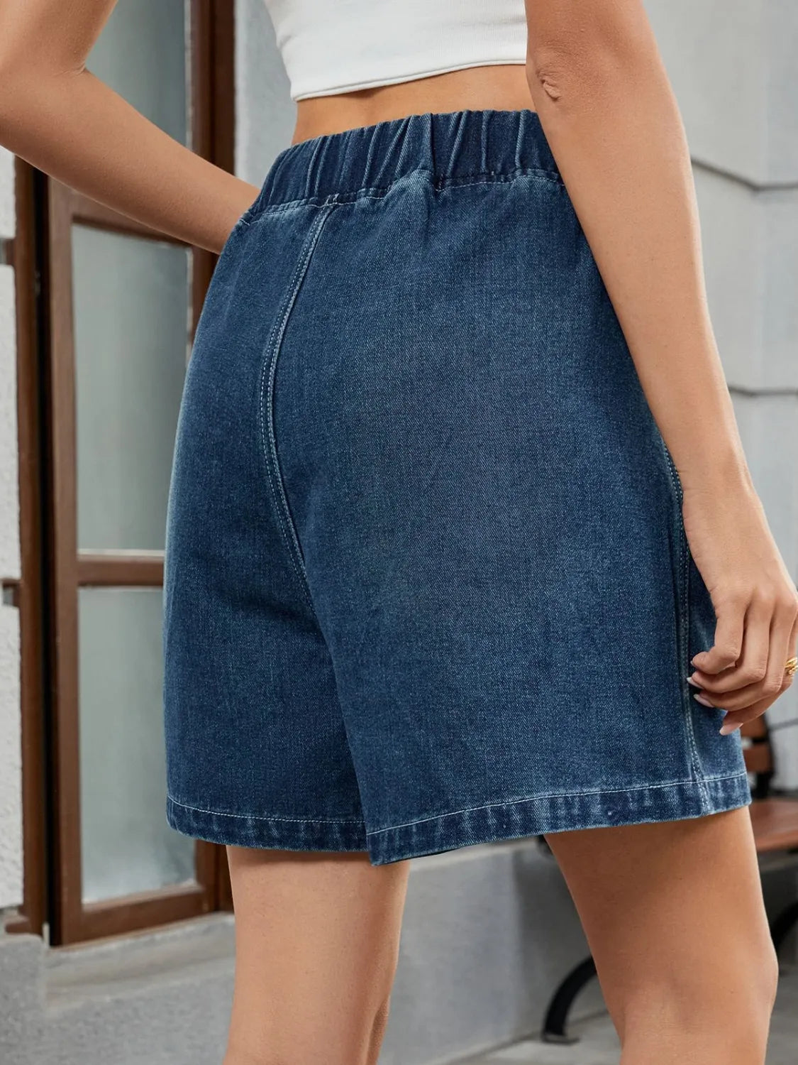 Elastic waist denim shorts with pockets.
