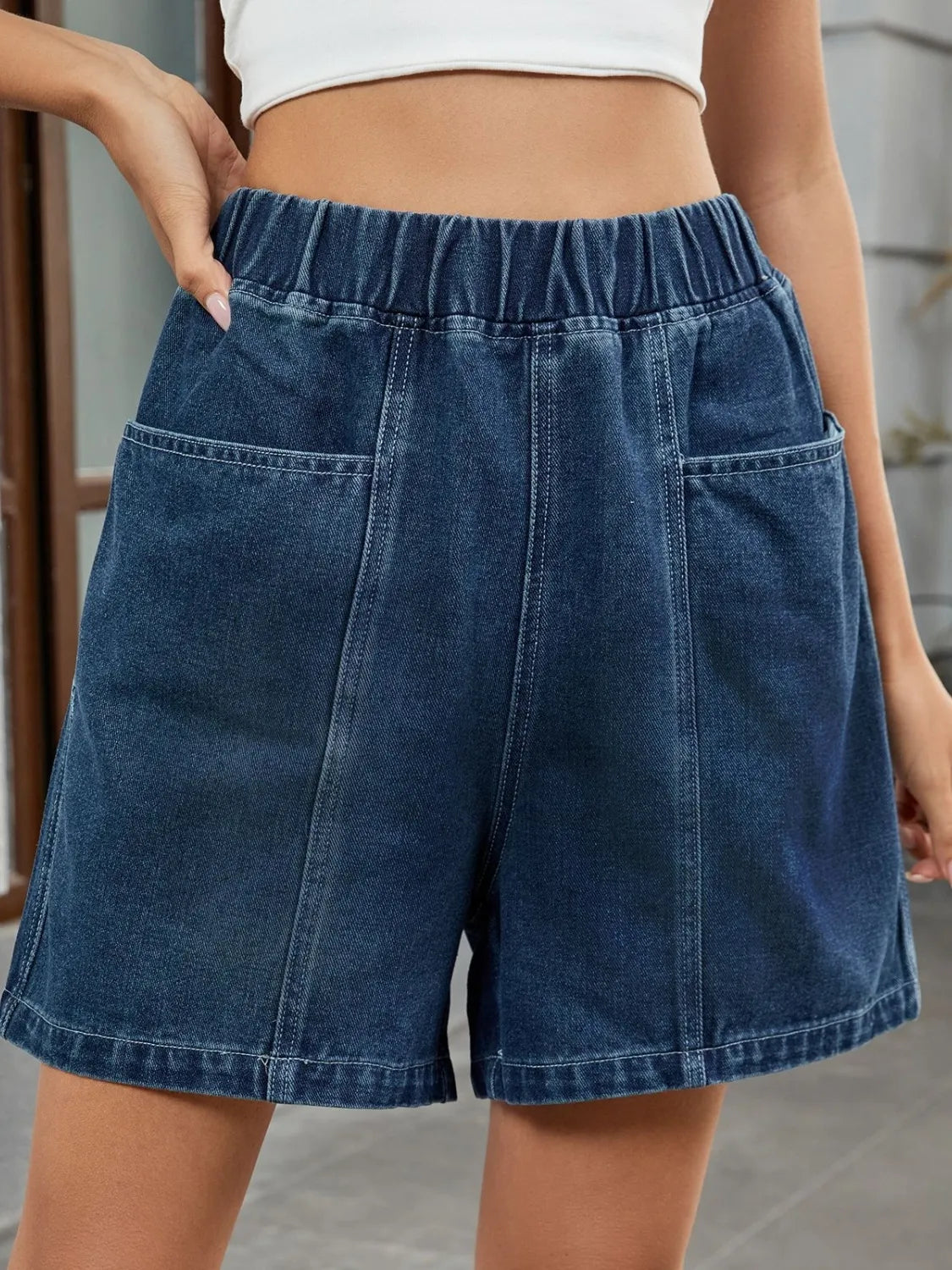 Elastic waist denim shorts with pockets.