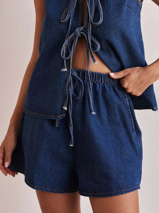 Elastic waist denim shorts with tie detail.