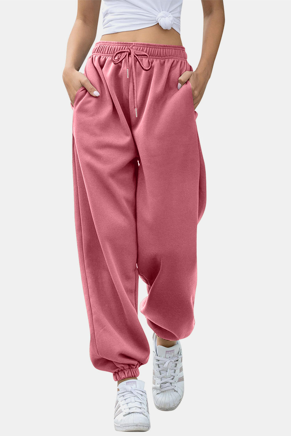 Elastic waist joggers with tie and pockets, opaque.