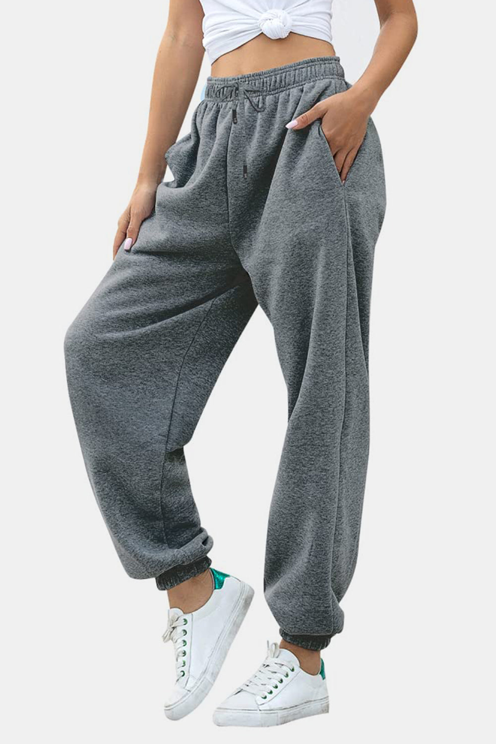 Elastic waist joggers with tie and pockets, opaque.