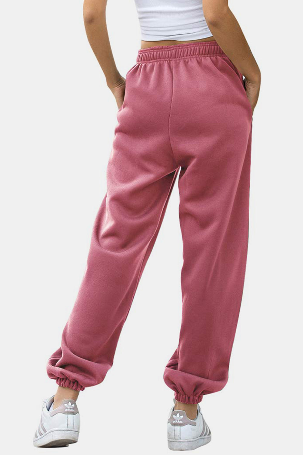 Elastic waist joggers with tie and pockets, opaque.
