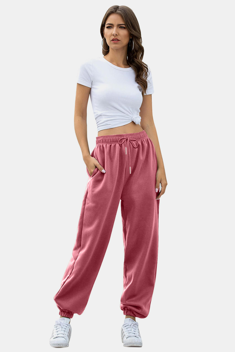 Elastic waist joggers with tie and pockets, opaque.