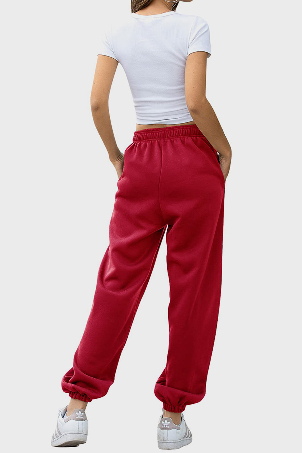 Elastic waist joggers with tie and pockets, opaque.