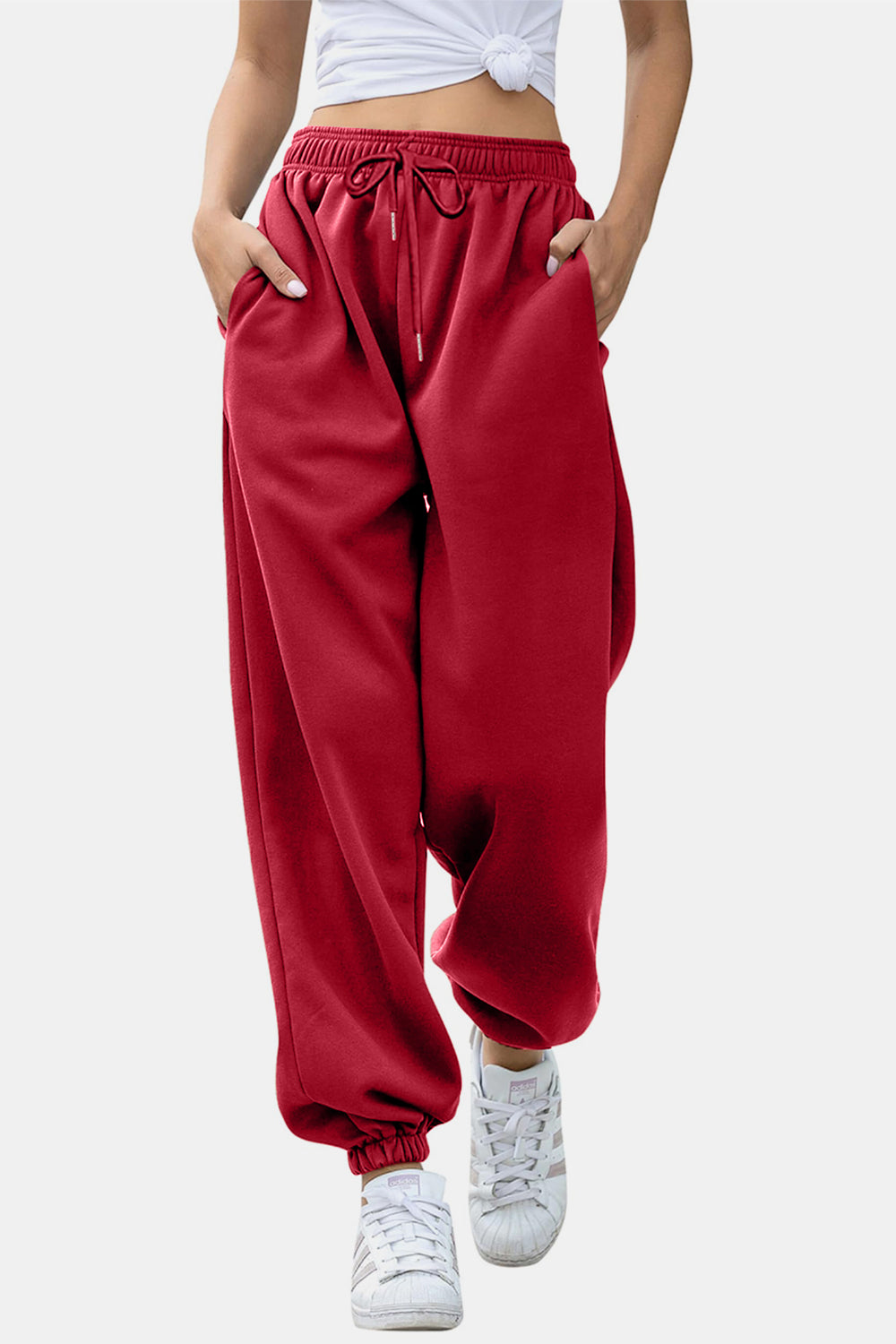 Elastic waist joggers with tie and pockets, opaque.