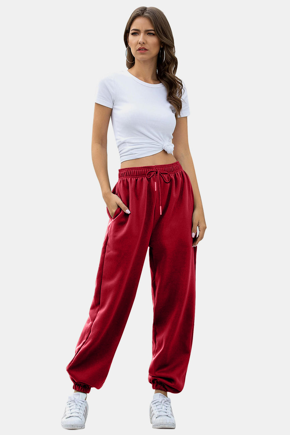 Elastic waist joggers with tie and pockets, opaque.