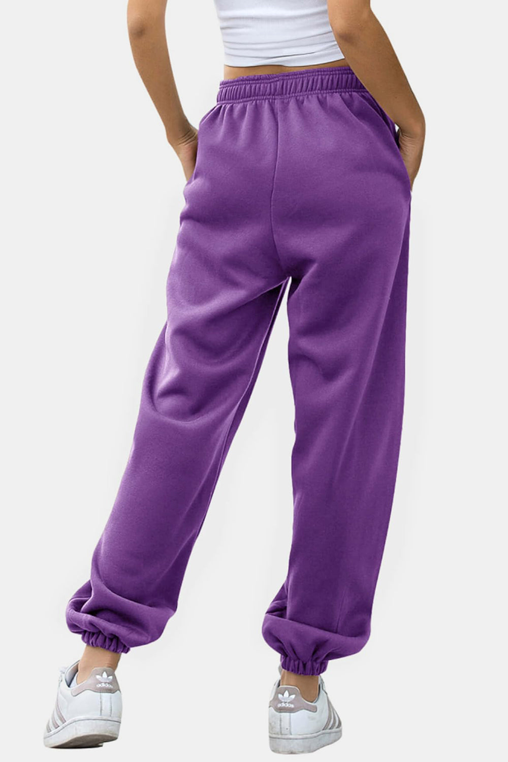 Elastic waist joggers with tie and pockets, opaque.
