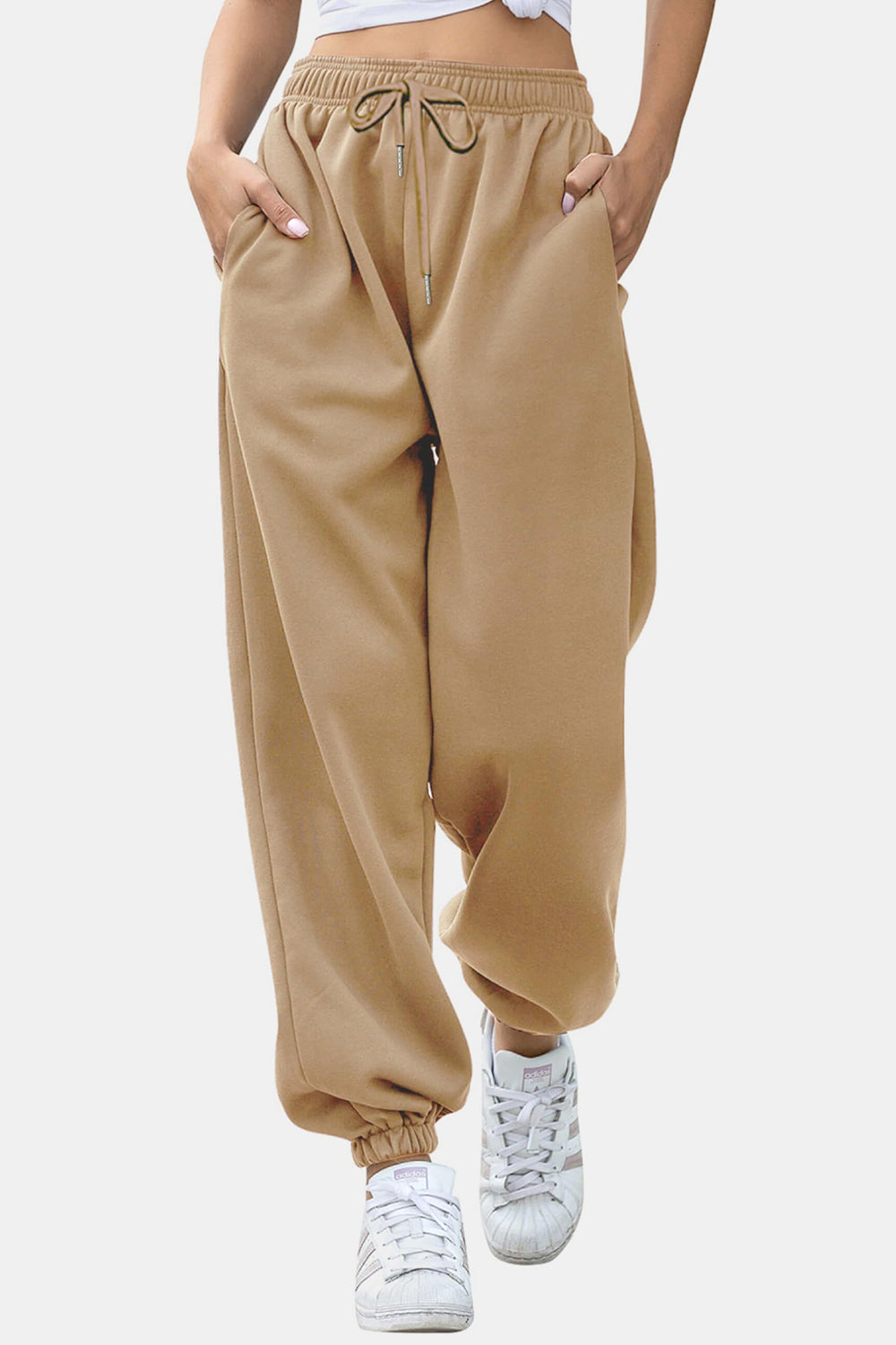 Elastic waist joggers with tie and pockets, opaque.