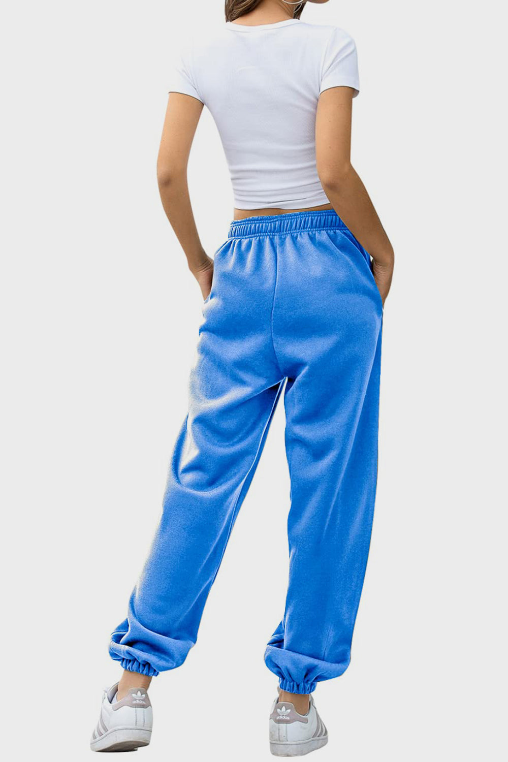 Elastic waist joggers with tie and pockets, opaque.