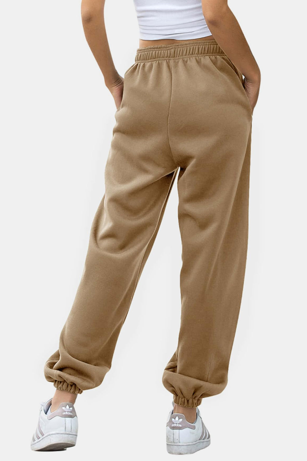 Elastic waist joggers with tie and pockets, opaque.