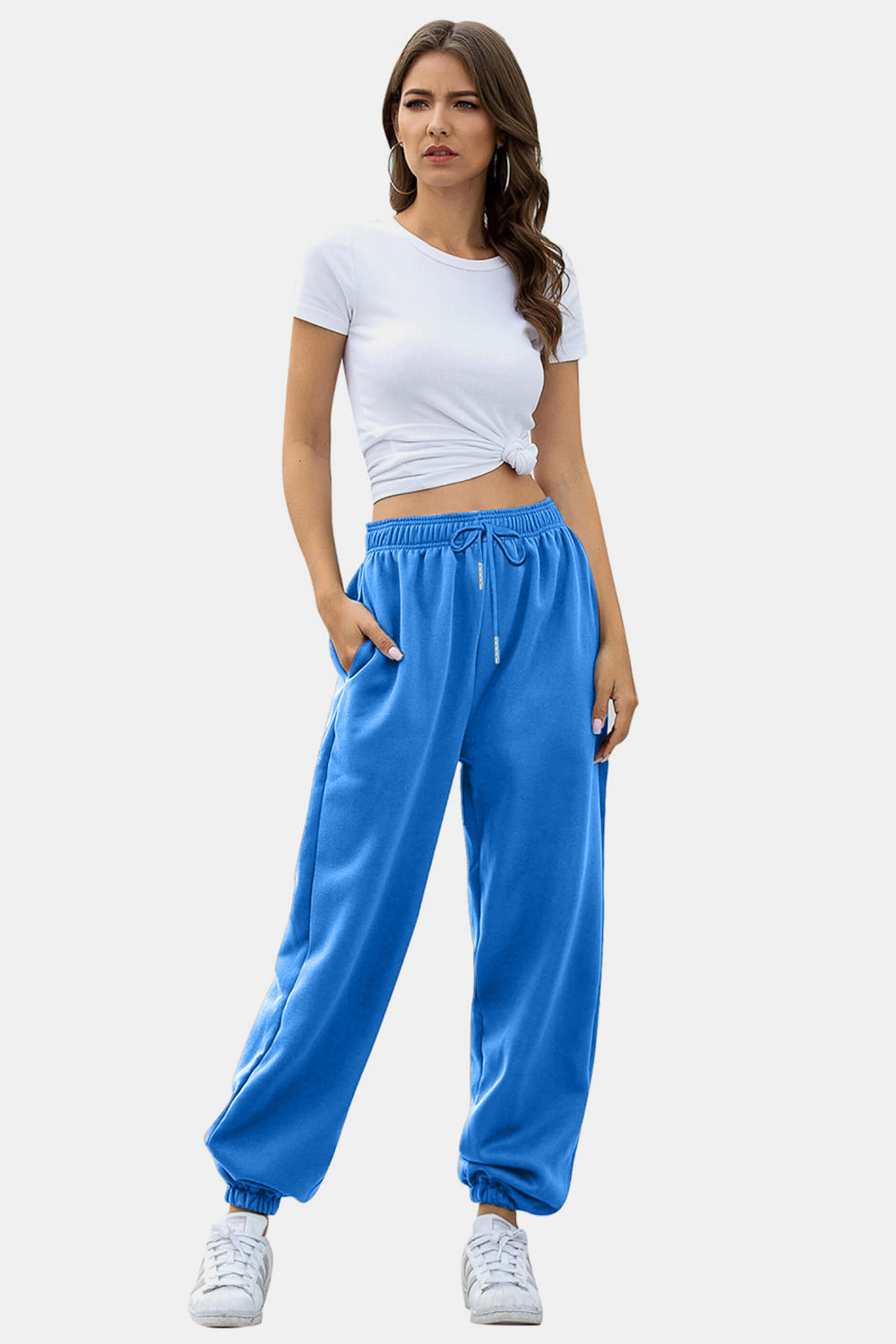 Elastic waist joggers with tie and pockets, opaque.