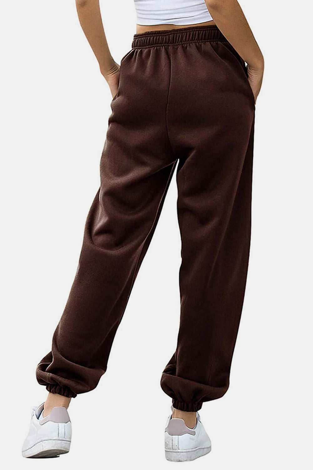 Elastic waist joggers with tie and pockets, opaque.