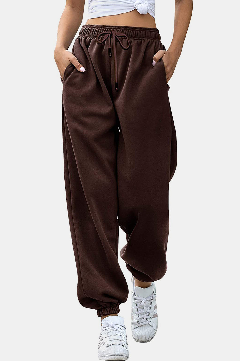 Elastic waist joggers with tie and pockets, opaque.
