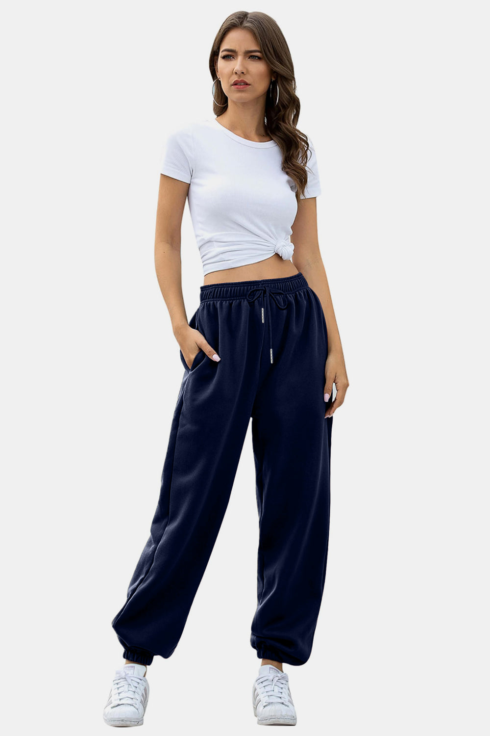 Elastic waist joggers with tie and pockets, opaque.