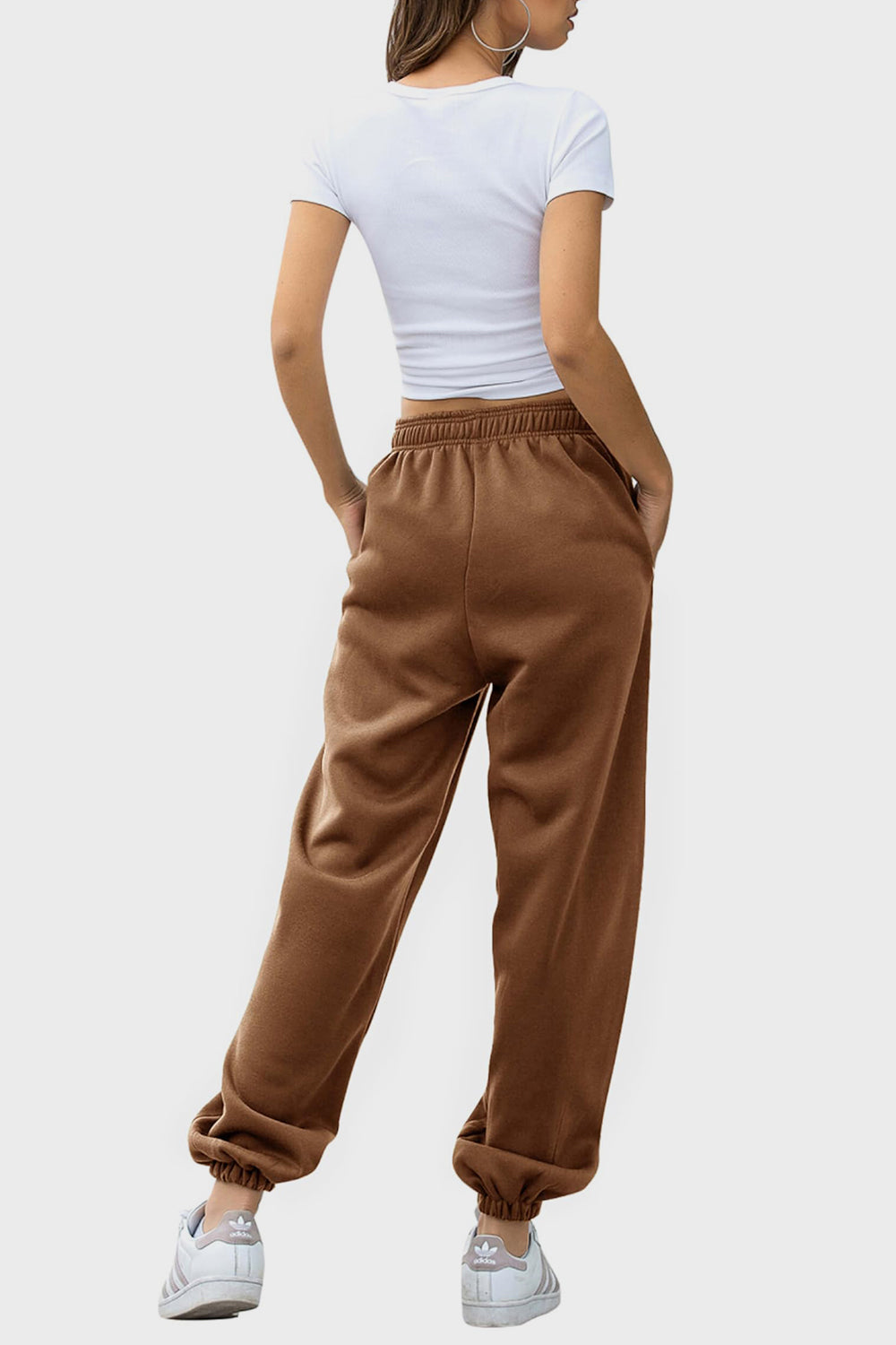 Elastic waist joggers with tie and pockets, opaque.