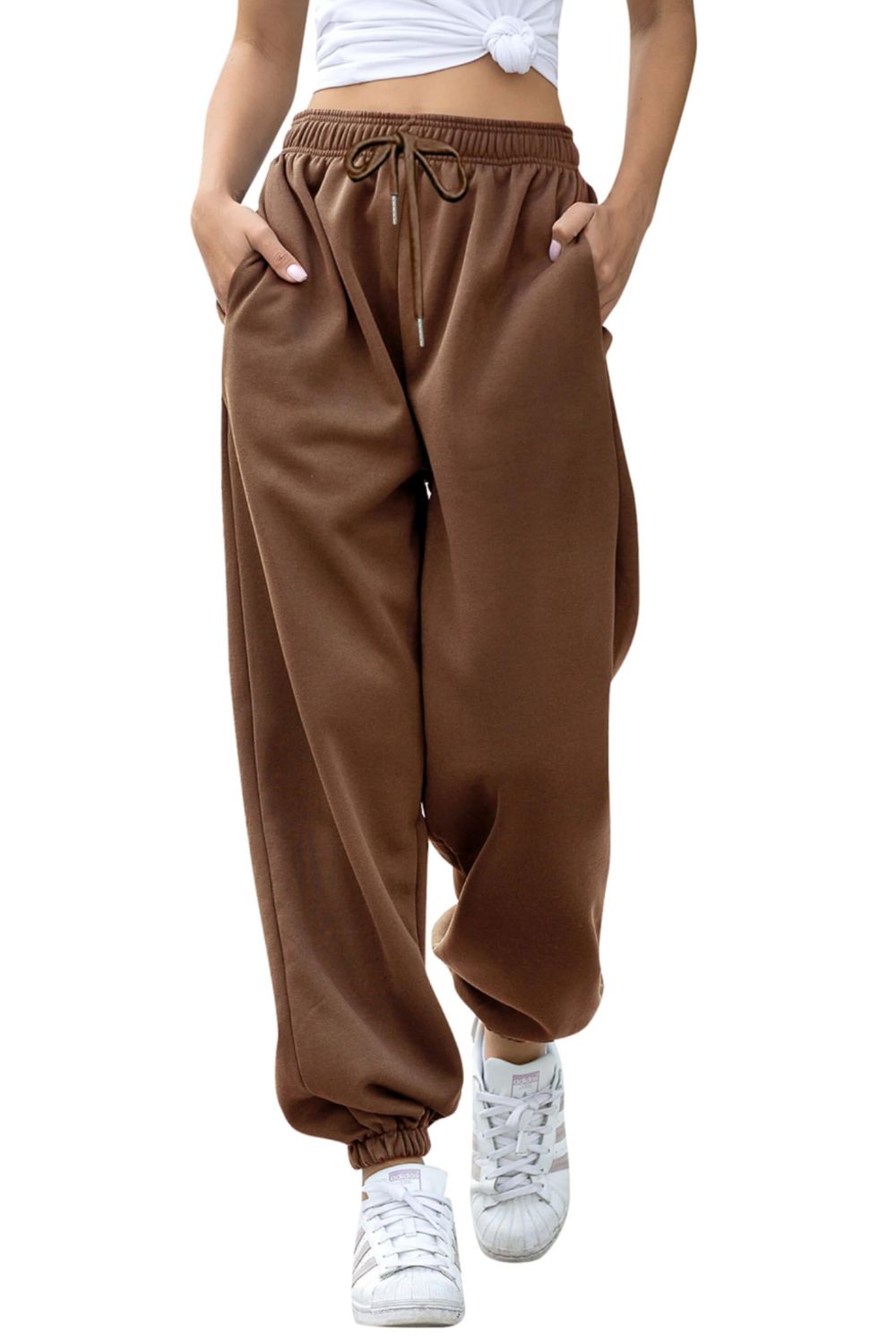 Elastic waist joggers with tie and pockets, opaque.