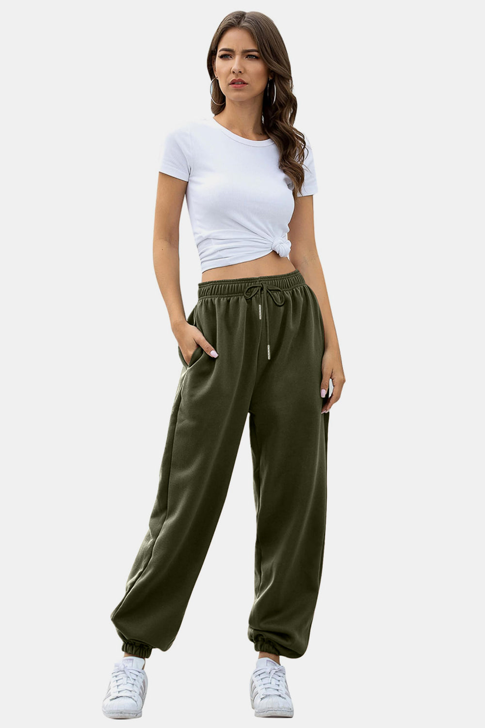 Elastic waist joggers with tie and pockets, opaque.