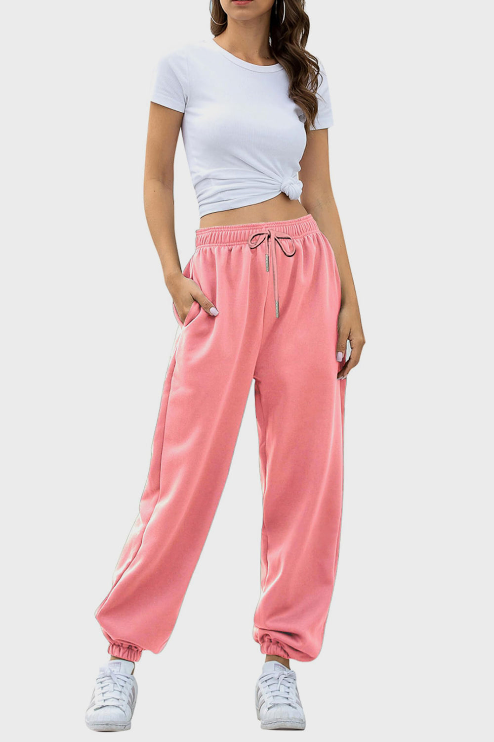 Elastic waist joggers with tie and pockets, opaque.