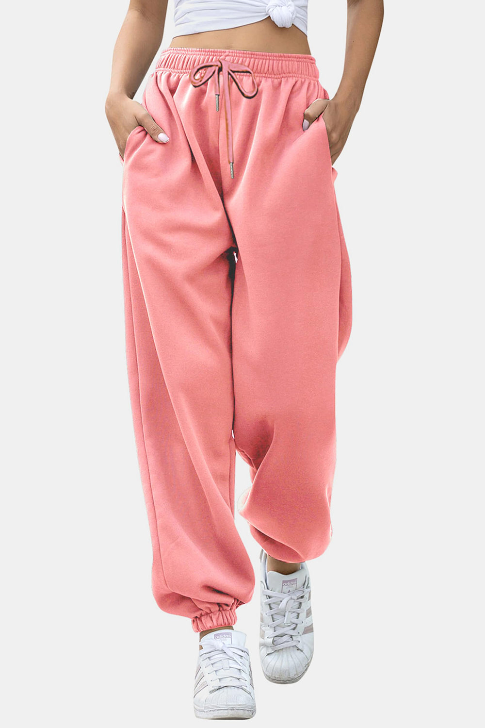 Elastic waist joggers with tie and pockets, opaque.
