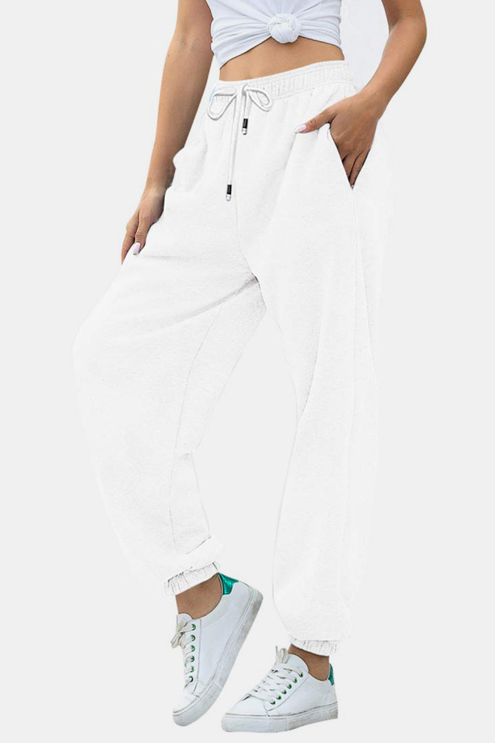 Elastic waist joggers with tie and pockets, opaque.