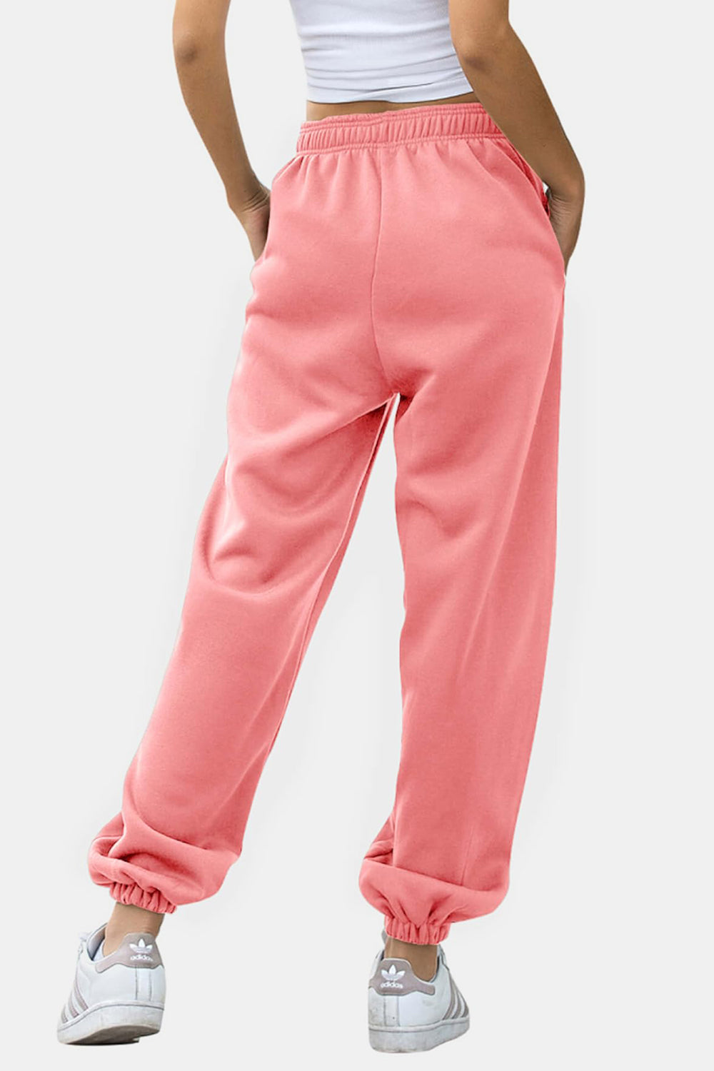 Elastic waist joggers with tie and pockets, opaque.