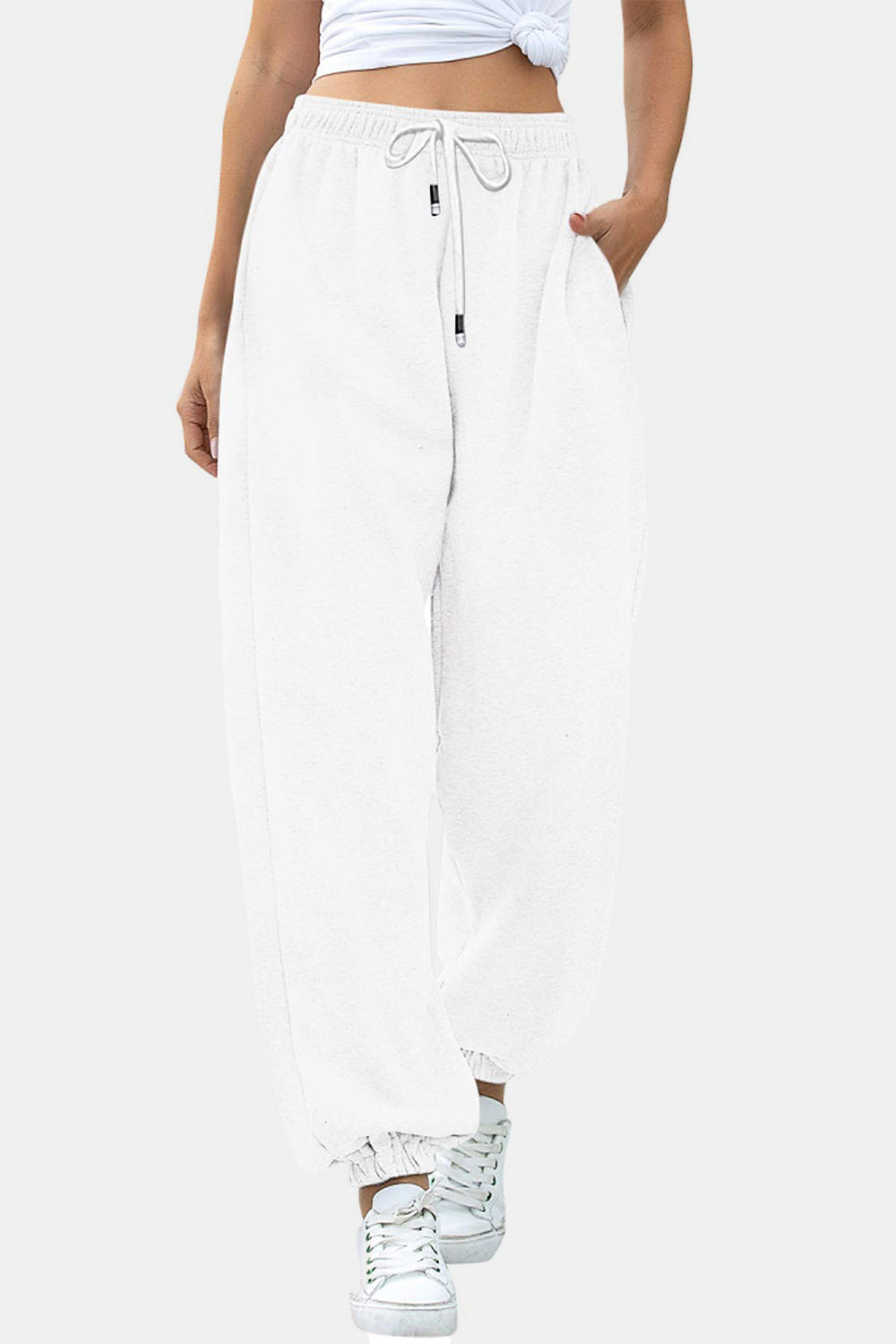 Elastic waist joggers with tie and pockets, opaque.