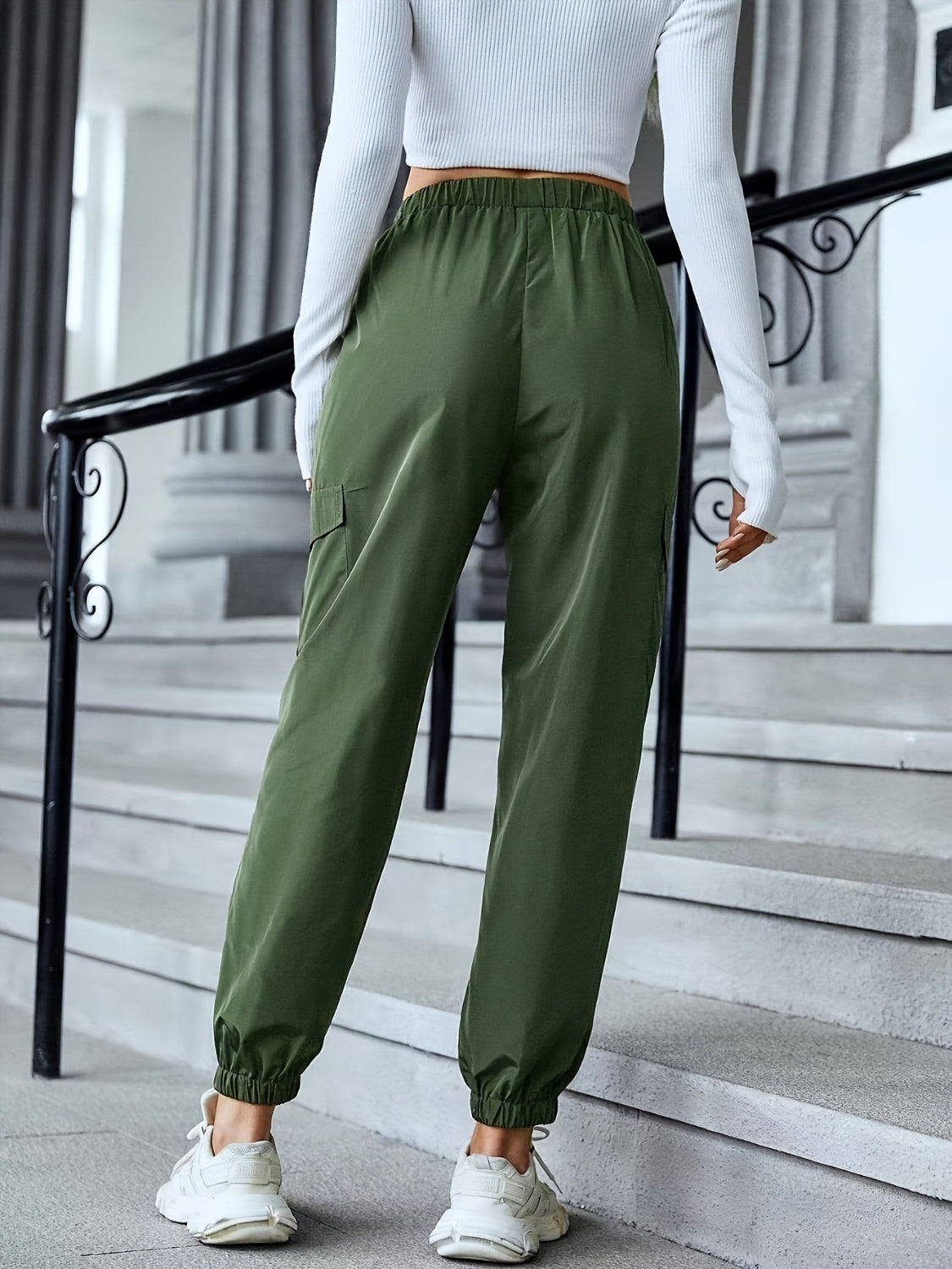 Full size elastic waist pants with pockets, opaque.