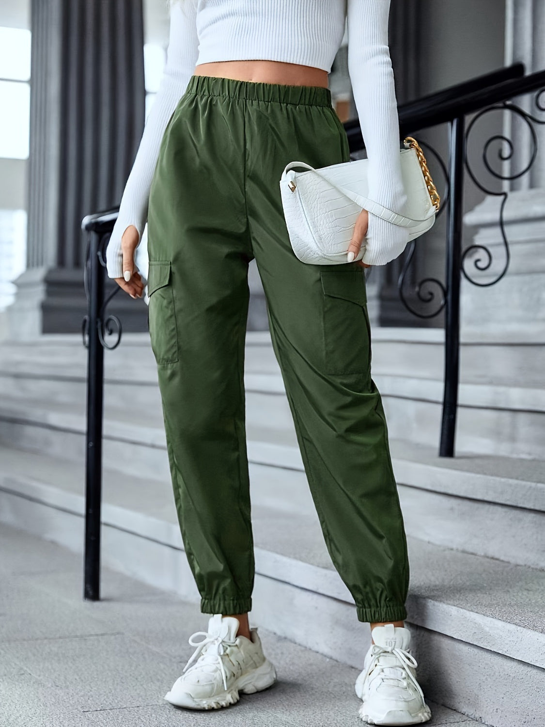 Full size elastic waist pants with pockets, opaque.