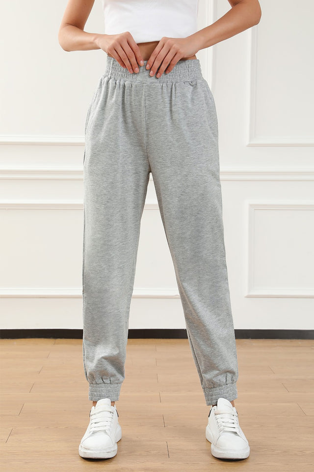 Elastic waist pocketed joggers, opaque.