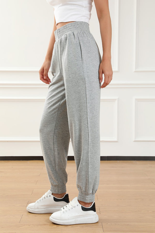 Elastic waist pocketed joggers, opaque.