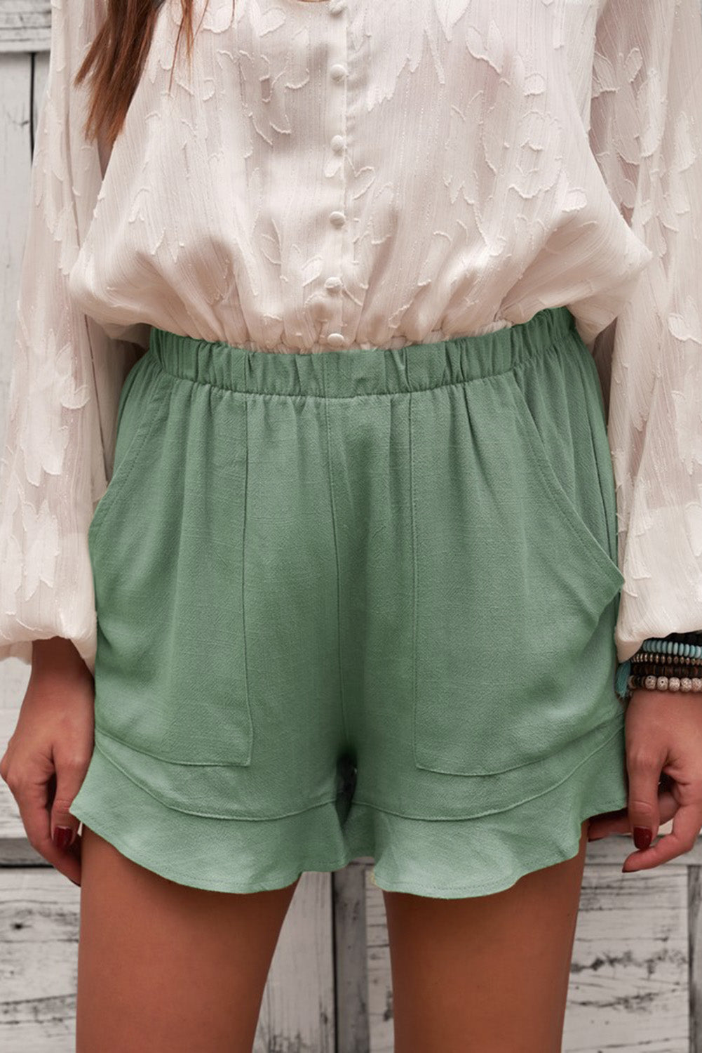 Elastic waist shorts with pockets.